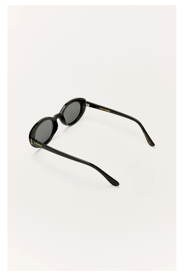 Z Supply Sunspell polarized sunglasses in glossy black with dark grey lenses, angled back view