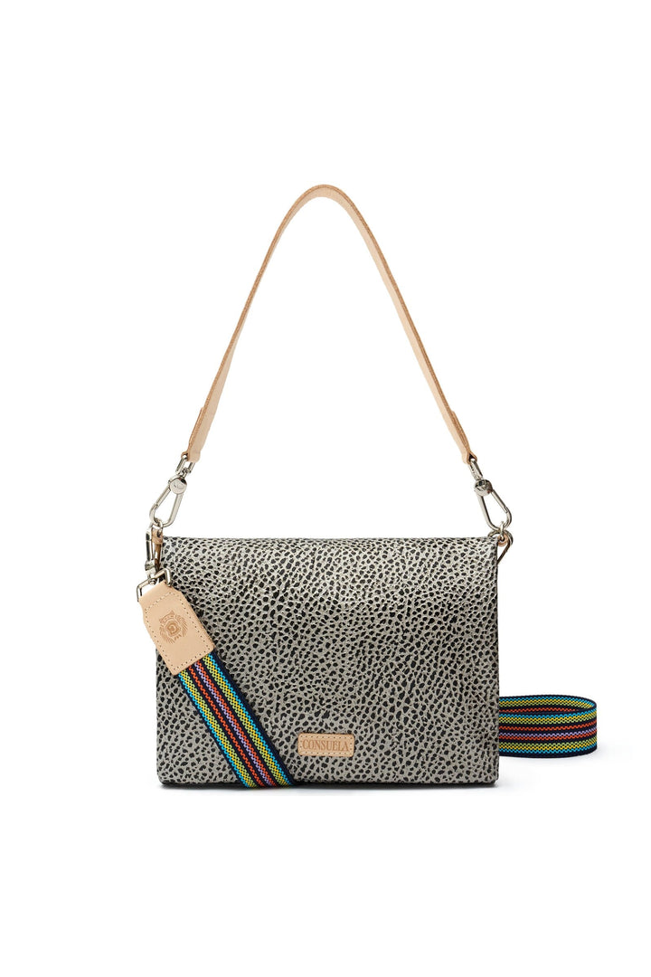 Consuela Metro Crossbody Tommy bag in silver grey cheetah print with tan leather strap and multicolor striped guitar strap