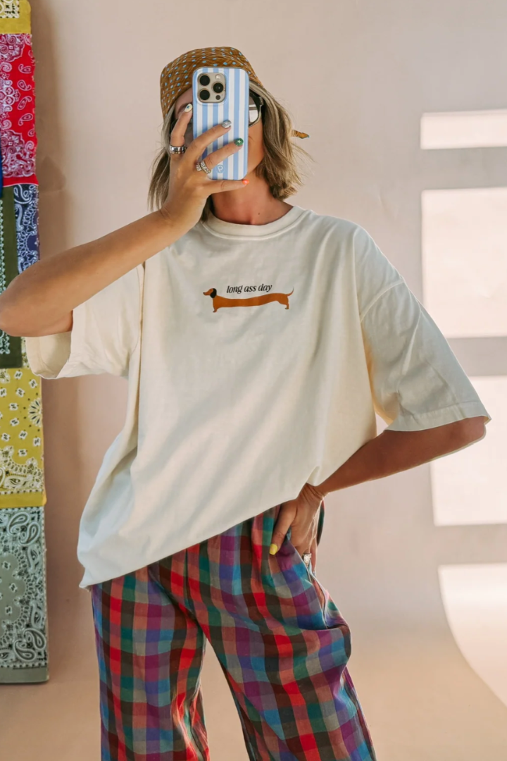 Oversized cream graphic tee with dachshund dog print and plaid wide-leg pants