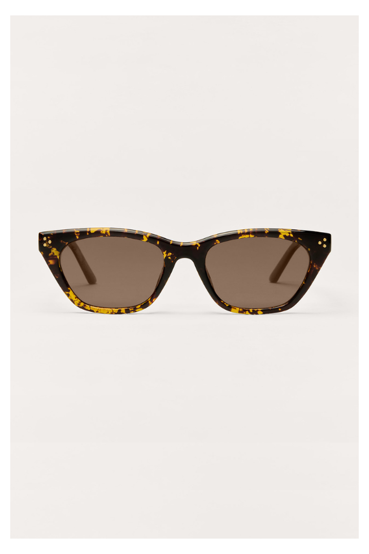Cat-eye sunglasses with brown tortoise frame featuring yellow flecks and brown lenses