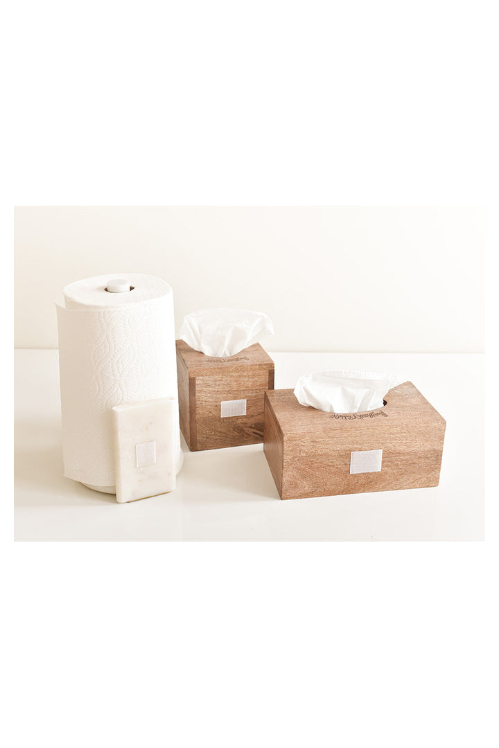 Happy Everything mini marble paper towel holder displayed alongside two wooden tissue boxes on white surface