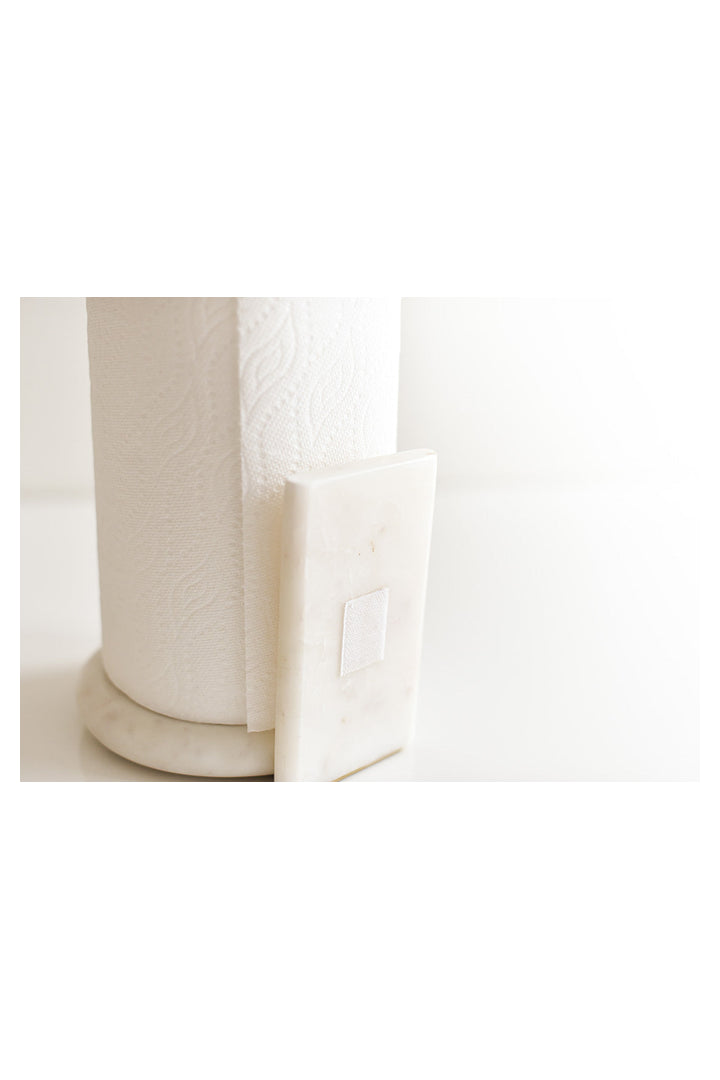 White marble paper towel holder with decorative arm holding a full paper towel roll