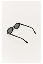 Z Supply Sunspell polarized sunglasses in glossy black with dark grey lenses, angled back view