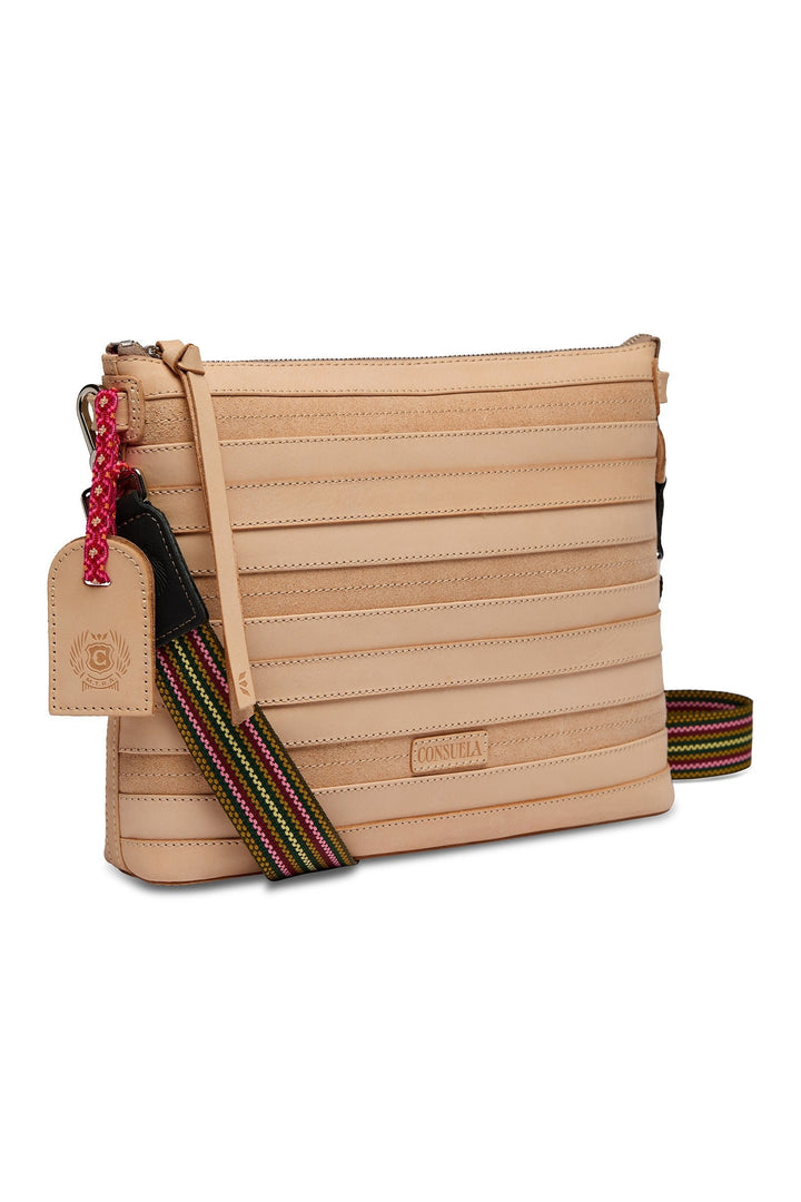 Consuela Amina Downtown Crossbody in natural tan leather with striped woven strap and luggage tag