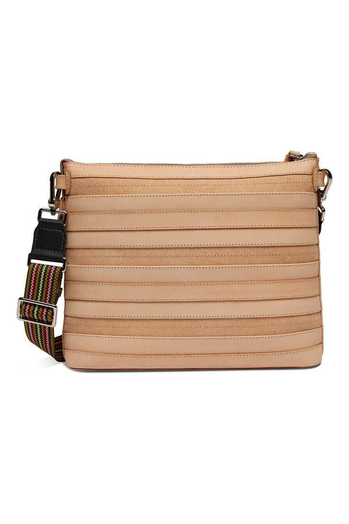 Consuela Amina Downtown Crossbody in natural tan leather with horizontal pleated detailing and multicolor woven strap